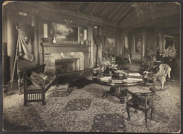 Trophy room at Sagamore Hill, summer home of President Theodore Roosevelt, with bison heads over the mantle