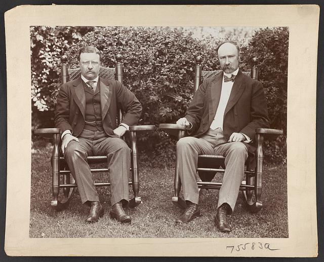 President Theodore Roosevelt and Senator Charles Fairbanks, seated in rocking chairs on a lawn at Sagamore Hill, Oyster Bay, N.Y. 1904